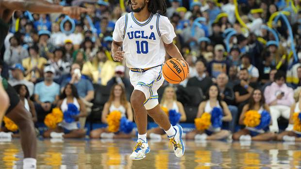 UCLA Bruins guard Tyger Campbell dribbles the ball up the floor.