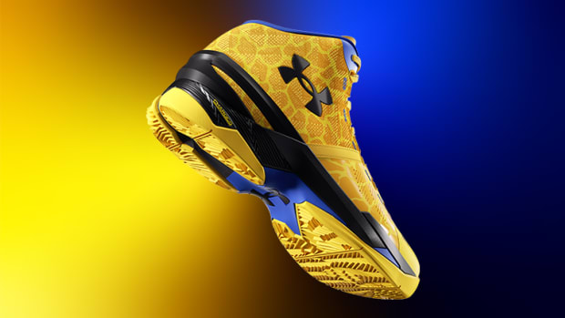 View of yellow and black Under Armour shoe.