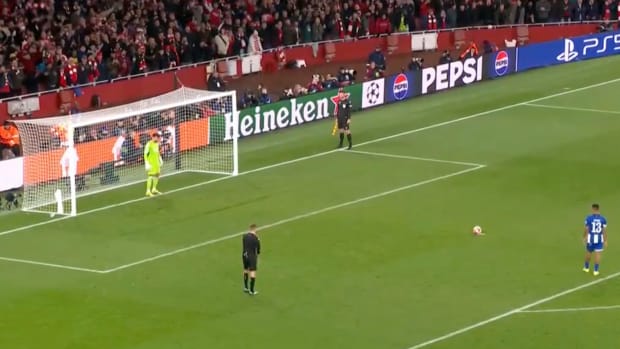 A picture captured moments before Arsenal goalkeeper David Raya (left) saved a penalty kick from Porto's Galeno (right) during a UEFA Champions League shootout in March 2024