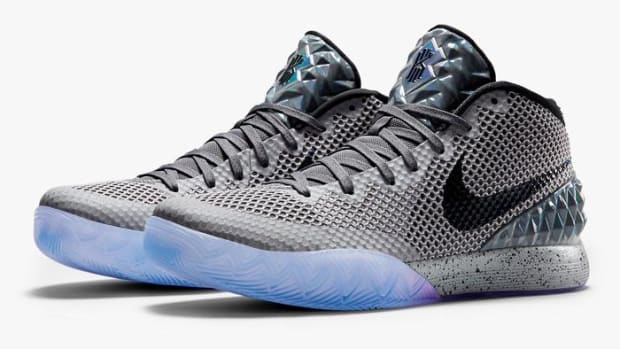 Grey and black Nike Kyrie shoes.