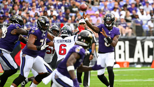 Ravens quarterback Lamar Jackson (8) throws a pass to wide receiver Zay Flowers (4) against the Houston Texans during the second half at M&T Bank Stadium.