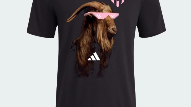 A black adidas shirt with a goat wearing pink sunglasses.