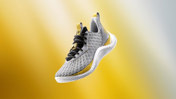 Side view of Stephen Curry's grey and gold shoe.