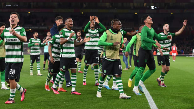 Sporting Lisbon players pictured celebrating after beating Arsenal in a penalty shootout to advance to the quarter-finals of the 2022/23 Europa League