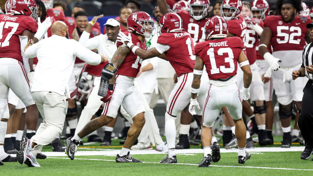 Alabama Crimson Tide defensive back Brian Branch (14) celebrates his interception against the Kansas State Wildcats during the second half in the 2022 Sugar Bowl at Caesars Superdome.