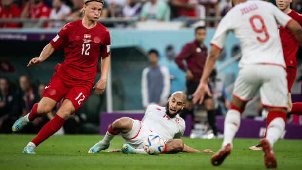 Tunisia defender Aissa Laidouni pictured (on the ground) during a game against Denmark at the 2022 FIFA World Cup