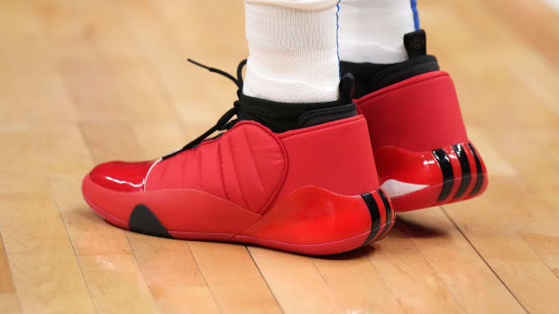 View of James Harden's red and black adidas shoes.