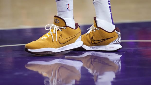 Los Angeles Lakers forward LeBron James's gold and maroon Nike sneakers.
