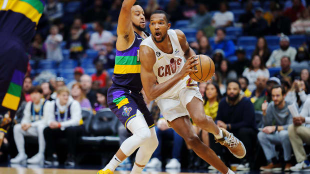 Feb 10, 2023; New Orleans, Louisiana, USA; Cleveland Cavaliers forward Evan Mobley (4) drives to the basket against New Orleans Pelicans guard CJ McCollum (3) during the first quarter at Smoothie King Center. Mandatory Credit: Andrew Wevers-USA TODAY Sports