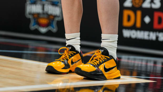 View of Caitlin Clark's black and gold Nike Kobe shoes.