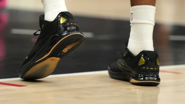 Los Angeles Clippers forward Kawhi Leonard's black and gold New Balance sneakers.