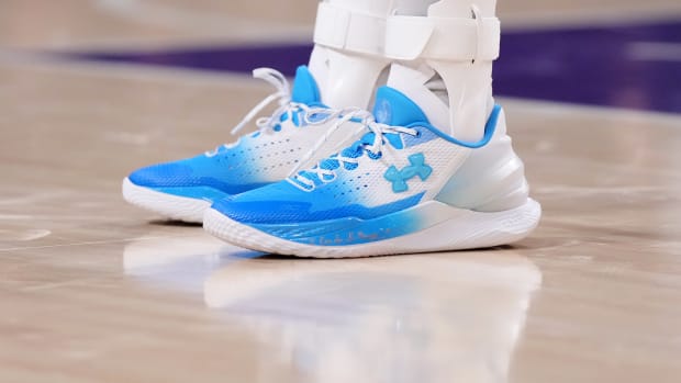 View of Stephen Curry's blue and white Under Armour shoes.