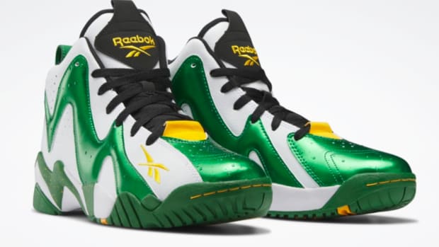 View of green and white Reebok shoes.