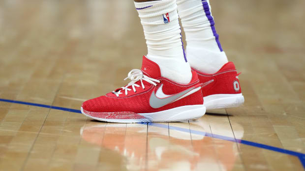 View of LeBron James' red and white Nike shoes.