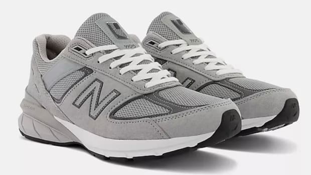 View of grey and white New Balance shoes.