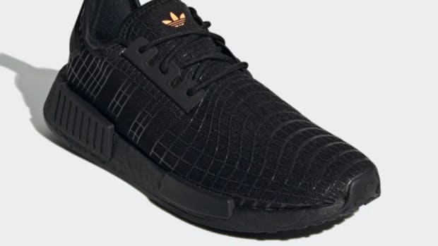 View of black Adidas shoe.