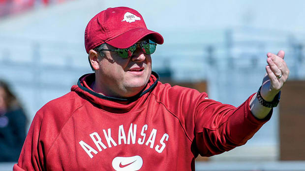 Former Arkansas tight ends coach Dowell Loggains waves a player over during spring practice. He has since moved on to South Carolina to be offensive coordinator.
