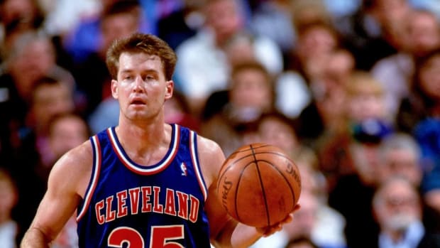 PORTLAND, OR - CIRCA 1994: Mark Price #25 of the Cleveland Cavaliers dribbles against the Portland Trailblazers during a game played circa 1994 at Memorial Coliseum in Portland, Oregon.