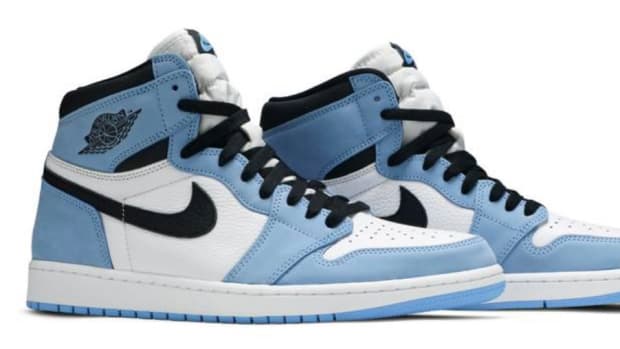 View of blue, white, and black Air Jordan shoes.