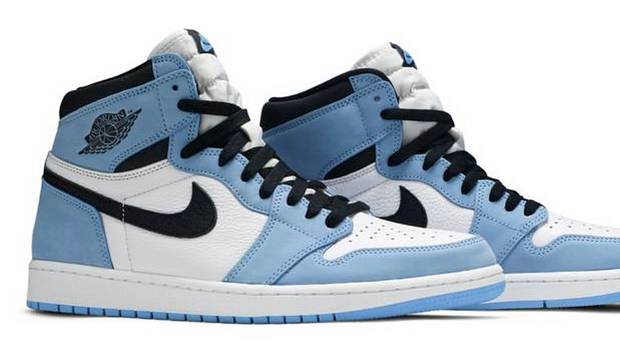 View of blue, white, and black Air Jordan shoes.