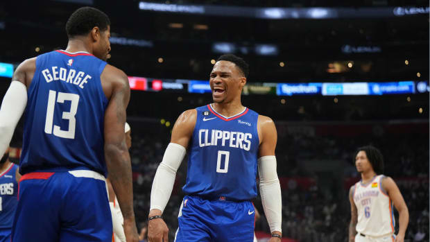 Mar 21, 2023; Los Angeles, California, USA; LA Clippers guard Russell Westbrook (0) and forward Paul George (13) react against the Oklahoma City Thunder in the second half at Crypto.com Arena. Mandatory Credit: Kirby Lee-USA TODAY Sports