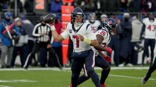 Jan 20, 2024; Baltimore, MD, USA; Houston Texans quarterback C.J. Stroud (7) throws a pass as running back Devin Singletary (26) blocks against the Baltimore Ravens during the first quarter of a 2024 AFC divisional round game at M&T Bank Stadium.