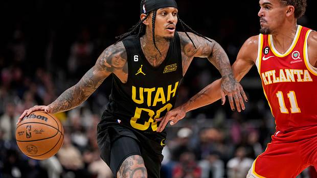 Hawks guard Trae Young defends Jazz guard Jordan Clarkson.