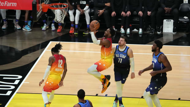 Feb 19, 2023; Salt Lake City, UT, USA; Team Giannis guard Donovan Mitchell (45) goes to the basket during the second half past Team LeBron forward Luka Doncic (77) in the 2023 NBA All-Star Game at Vivint Arena. Mandatory Credit: Kirby Lee-USA TODAY Sports