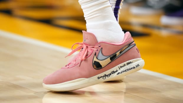 View of LeBron James' pink and white Nike shoes.