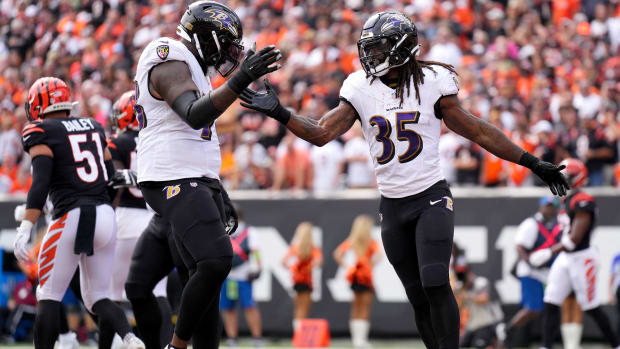 Baltimore Ravens running back Gus Edwards (35) celebrates a touchdown with Baltimore Ravens offensive tackle Morgan Moses (78) in the first quarter of a Week 2 NFL football game between the Baltimore Ravens and the Cincinnati Bengals Sunday, Sept. 17, 2023, at Paycor Stadium in Cincinnati.