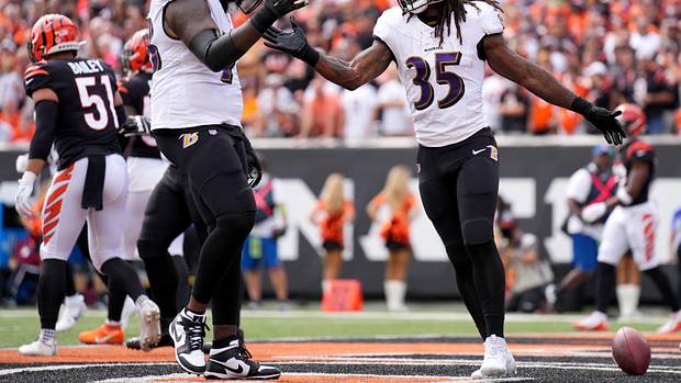 Baltimore Ravens running back Gus Edwards (35) celebrates a touchdown with Baltimore Ravens offensive tackle Morgan Moses (78) in the first quarter of a Week 2 NFL football game between the Baltimore Ravens and the Cincinnati Bengals Sunday, Sept. 17, 2023, at Paycor Stadium in Cincinnati.