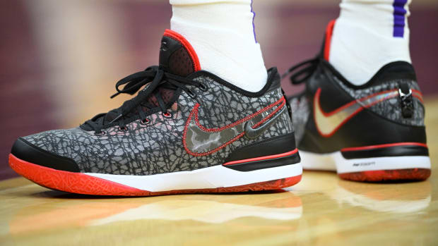 A detailed view of black and red Nike LeBron shoes.