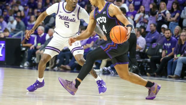 Feb 17, 2024; Manhattan, Kansas, USA; TCU Horned Frogs guard Jameer Nelson Jr. (4) is guarded by Kansas State Wildcats guard Cam Carter (5) during the first half at Bramlage Coliseum. Mandatory Credit: Scott Sewell-USA TODAY Sports  