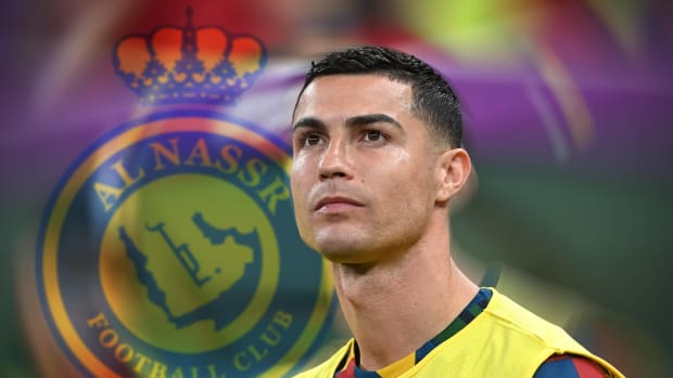 Cristiano Ronaldo pictured next to a superimposed image of the Al Nassr FC logo