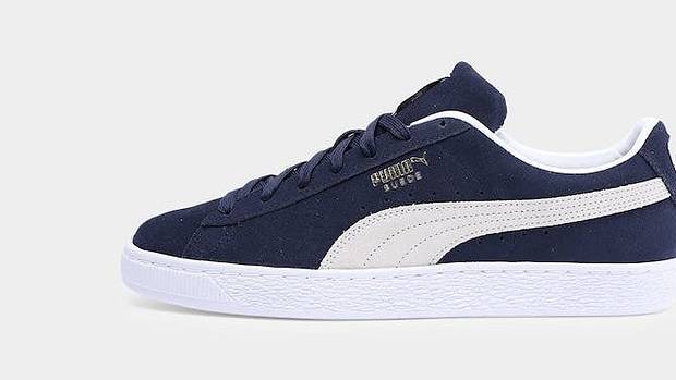 Side view of a navy and white PUMA sneaker.