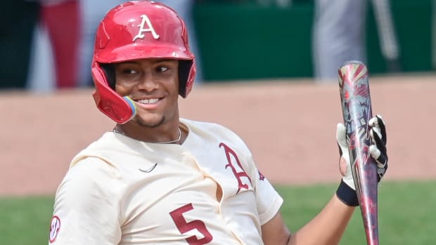 Arkansas Razorbacks baseball player Kendall Diggs smiles before an at-bat against the South Carolina Gamecocks.