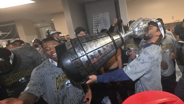Nov 20, 2022; Regina, Saskatchewan, CAN; A Toronto Argonauts celebrate with the Grey cup in the dressing room at the end of the fourth quarter at the 109th Grey Cup at Mosaic Stadium. Toronto won the game 24-23. Mandatory Credit: Walter Tychnowicz-USA TODAY Sports  