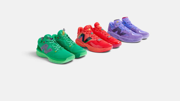 Side view of green, red, and purple New Balance basketball shoes.