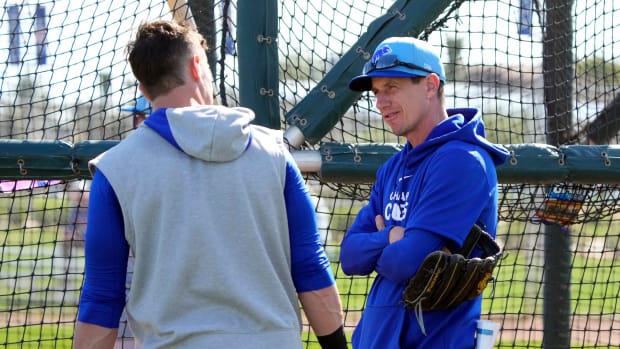 Feb 18, 2024; Mesa, AZ, USA; Chicago Cubs manager Craig Counsell talks to catcher Yan Gomes (15) during Spring Training camp at Sloan Park.