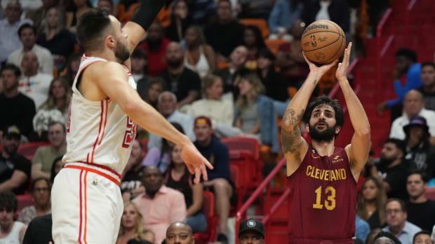 Mar 10, 2023; Miami, Florida, USA; Cleveland Cavaliers guard Ricky Rubio (13) takes a three-point shot as Miami Heat guard Max Strus (31) defends in the second half at Miami-Dade Arena. Mandatory Credit: Jim Rassol-USA TODAY Sports