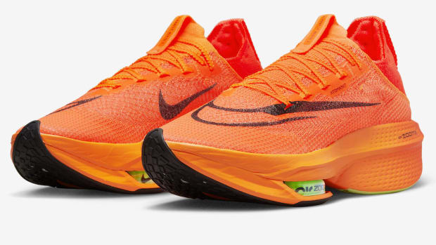Orange Nike running shoes.
