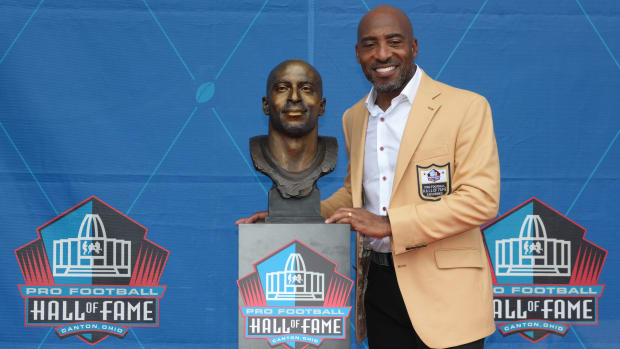 Ronde Barber poses with his bust during the 2023 Pro Football Hall of Fame Enshrinement.