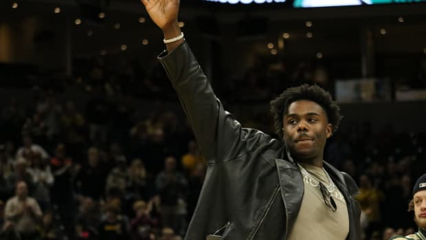 Feb 20, 2024; Columbia, Missouri, USA; Los Angeles Clippers guard Kobe Brown waves during a timeout as he's honored at center court during the Missouri Tigers' conference matchup against the Tennessee Volunteers.