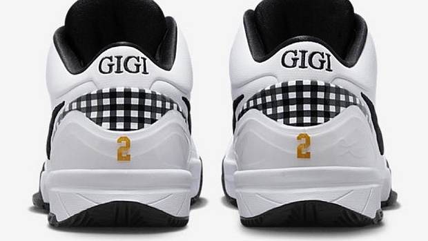 Rear view of white and black Nike Kobe shoes.