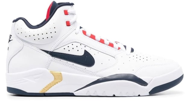 White and navy Nike Air Flight shoes.