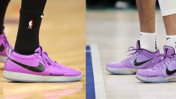 Side view of Devin Booker's purple and black Nike sneakers.