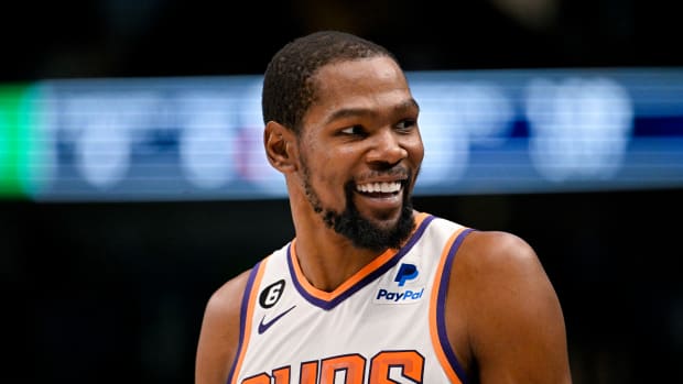 Phoenix Suns forward Kevin Durant smiles during a game.