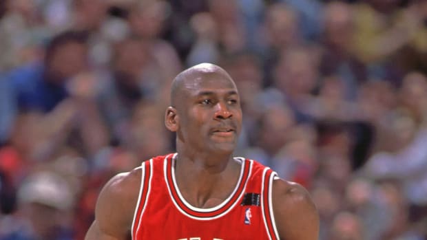Chicago Bulls guard (23) Michael Jordan dribbling the ball during the game against Orlando Magic at the Orlando Arena