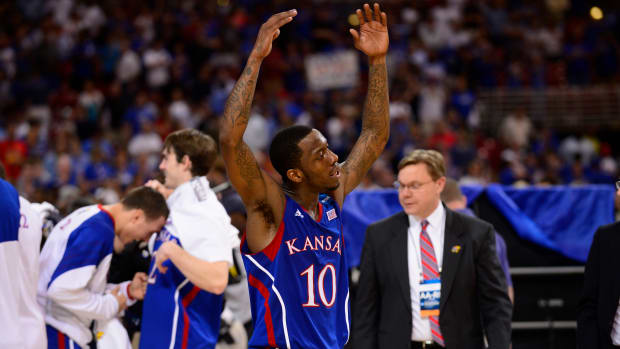 Mar 25, 2012; St. Louis, MO, USA; Kansas Jayhawks guard Tyshawn Taylor (10) reacts after the finals of the midwest region of the 2012 NCAA men's basketball tournament against the North Carolina Tar Heels at the Edward Jones Dome. Kansas won 80-67. Mandatory Credit: Scott Rovak-USA TODAY Sports