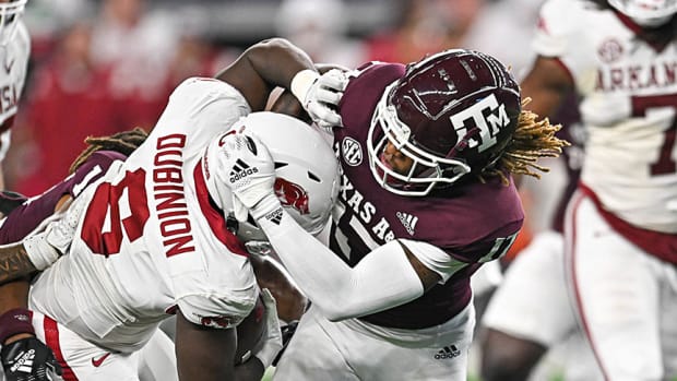 Arkansas Razorbacks running back Rashod Dubinion is tackled during a game against the Texas A&M Aggies on Saturday, Sept. 24, 2022, at AT&T Stadium in Arlington, Texas.